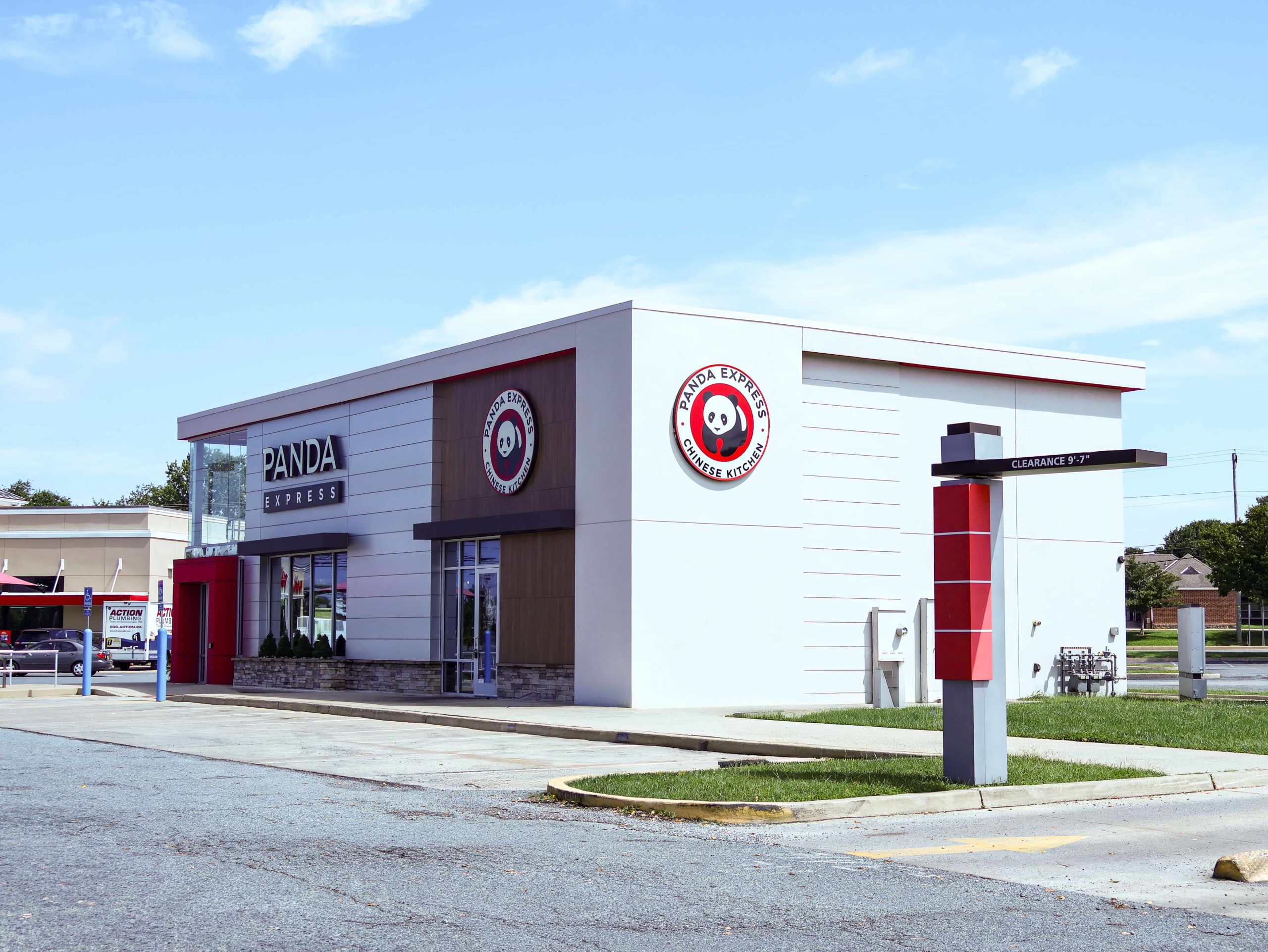 Panda Express restaurant exterior with red and white signage and drive-through clearance sign in a shopping center