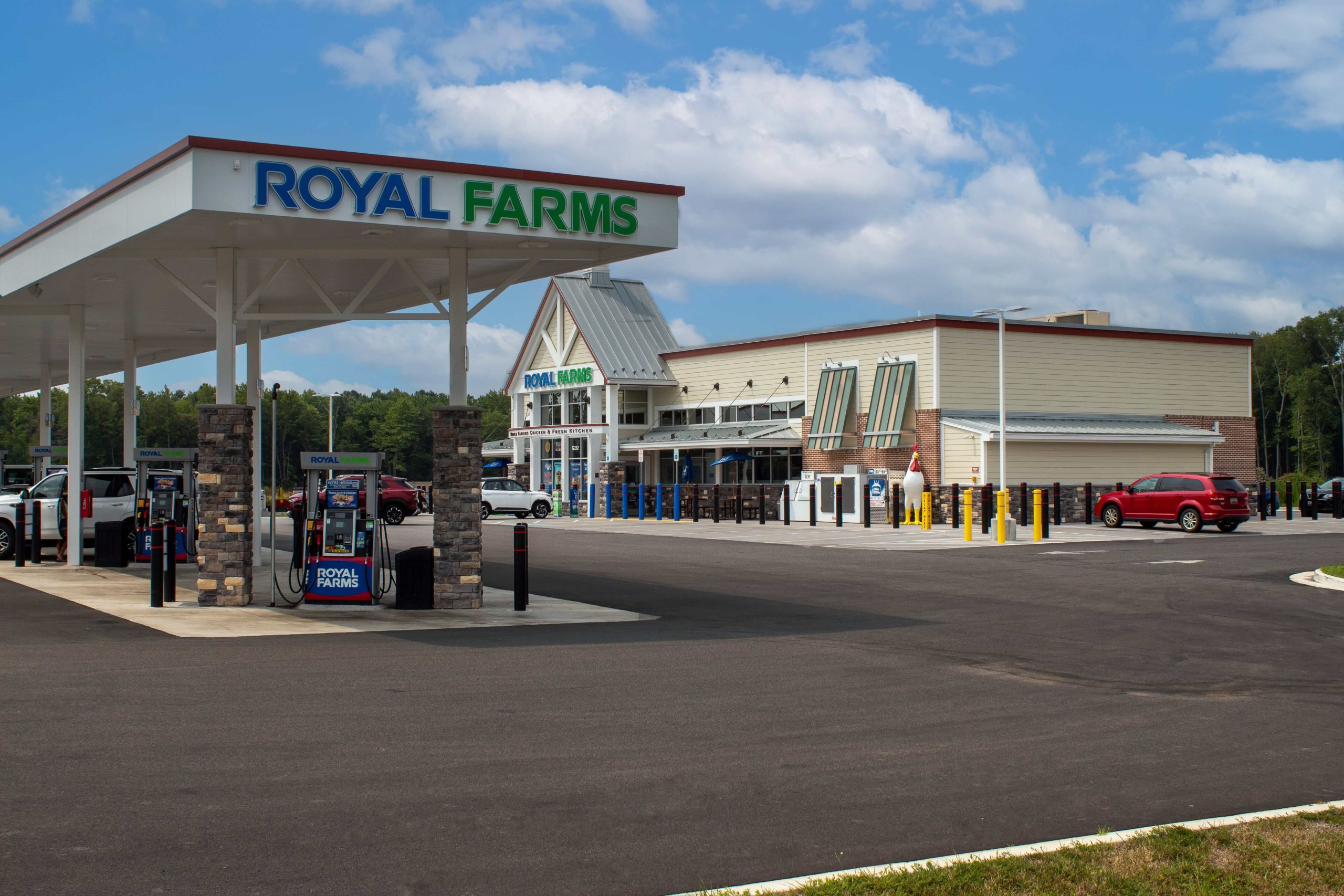 Royal Farms gas station and convenience store with fuel canopy, parked cars, and covered parking lot at Somerset Crossing.