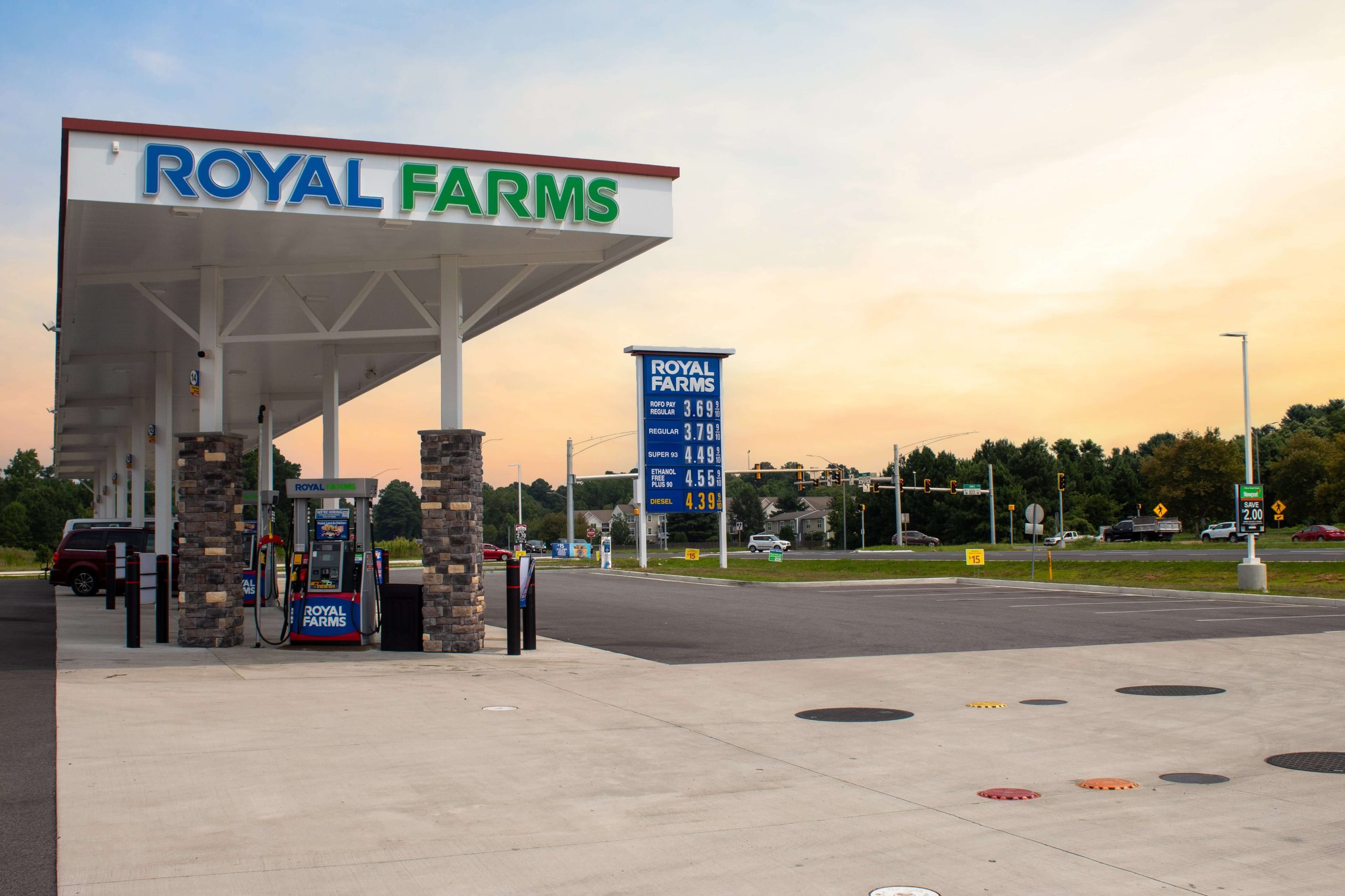 Royal Farms gas station canopy and price sign at dusk near Somerset Crossing in Wilmington, DE