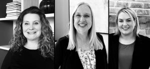 Black and white portrait of three Capano Management employees who have received recent promotions within the Regional Property Management Team