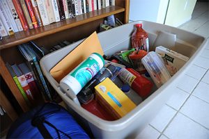 Emergency supplies in a grey storage container